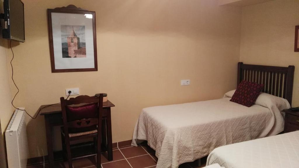 Postel nebo postele na pokoji v ubytování El rincon de Paco