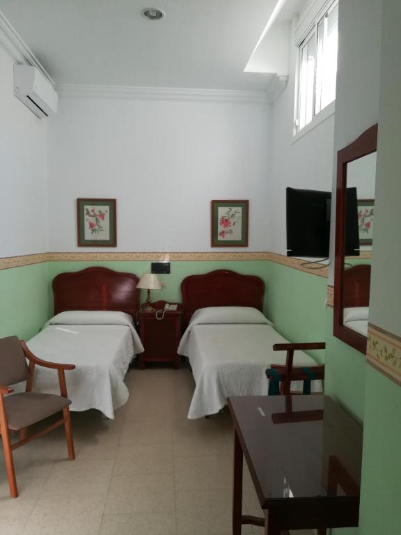 TV a/nebo společenská místnost v ubytování Nuevo Hotel