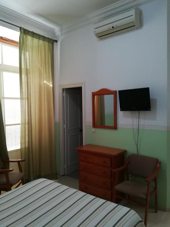 TV a/nebo společenská místnost v ubytování Nuevo Hotel