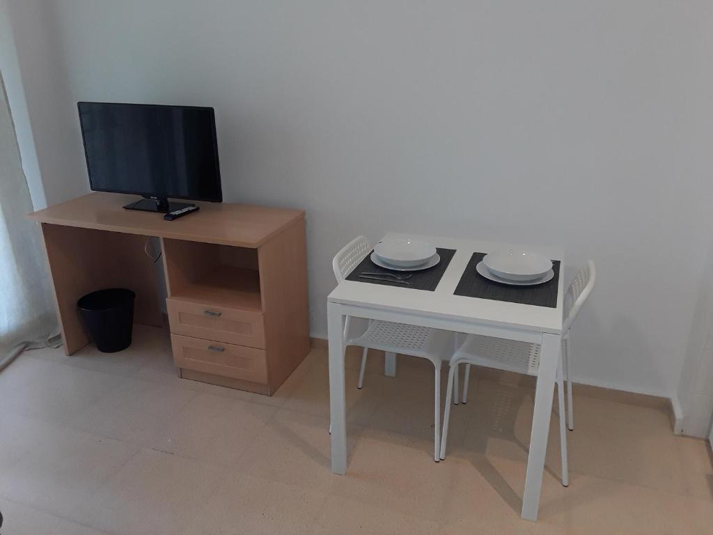 Televízia a/alebo spoločenská miestnosť v ubytovaní Fan Flat Torremolinos