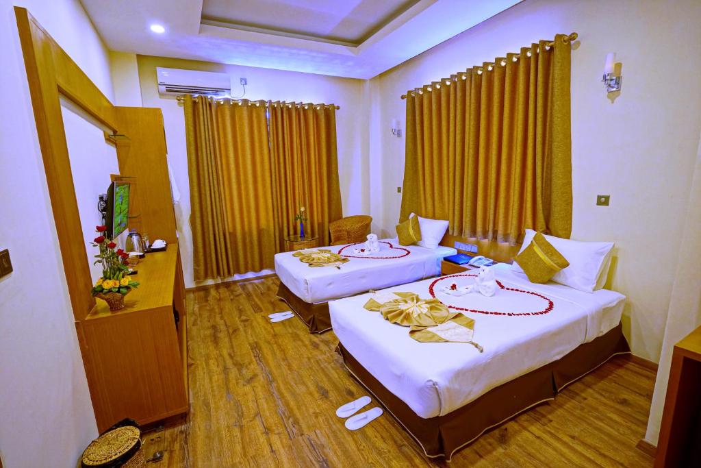 Postel nebo postele na pokoji v ubytování The Hotel Nova