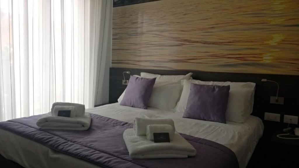 Postel nebo postele na pokoji v ubytování Hotel Tre Rose