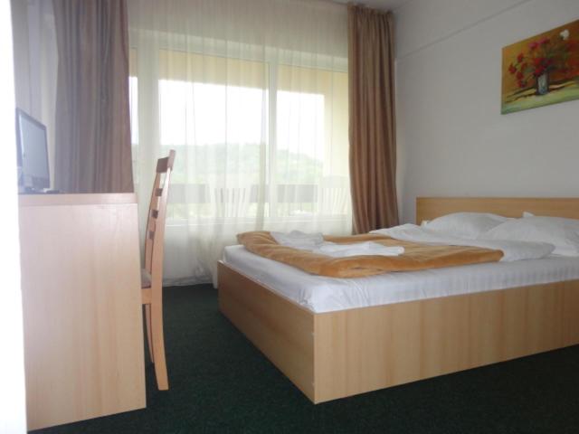 Postel nebo postele na pokoji v ubytování Hotel Diana