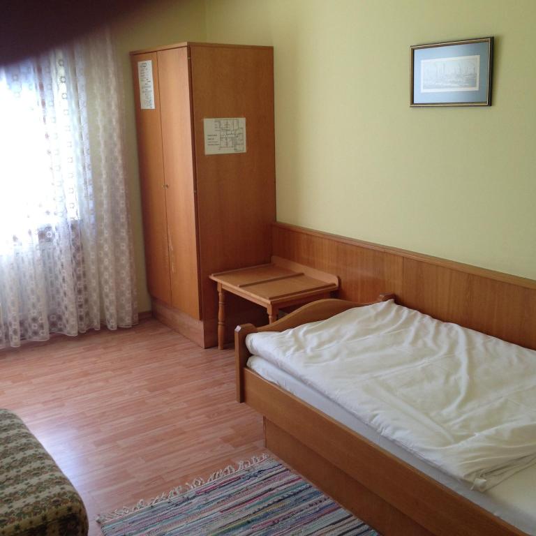 Postel nebo postele na pokoji v ubytování Hotel Sonnenhof
