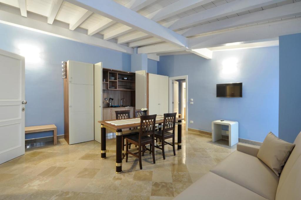 TV a/nebo společenská místnost v ubytování Palazzo Massari