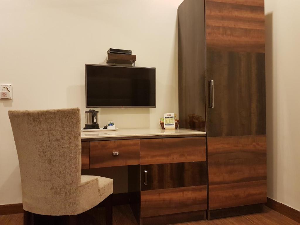 TV a/nebo společenská místnost v ubytování Hotel Sunstar Grand