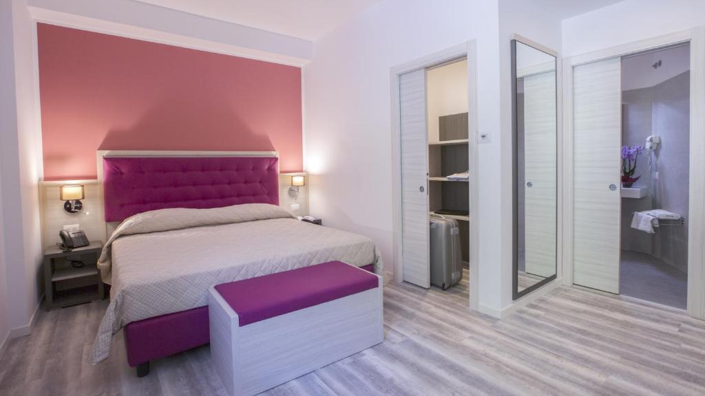 Postel nebo postele na pokoji v ubytování Alma Living Hotel- Al Girarrosto