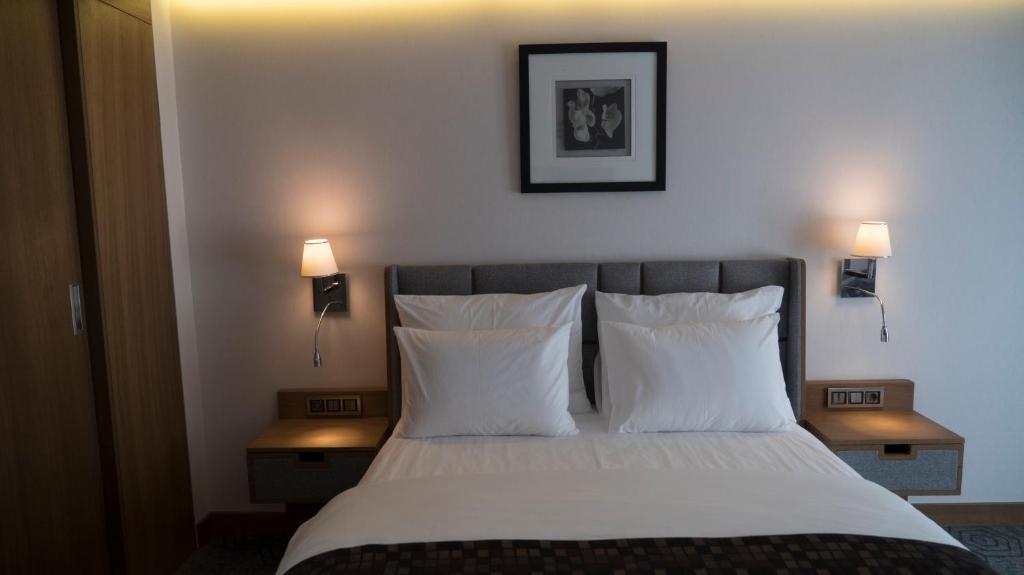 A bed or beds in a room at Yuksel Istanbul Yenikapı Hotel