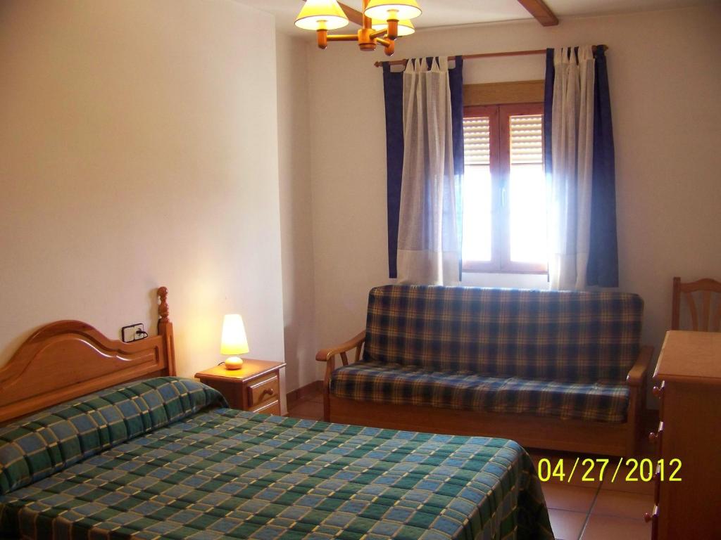 Postel nebo postele na pokoji v ubytování Apartamentos La Iruela 2