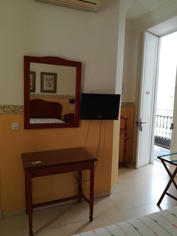 TV a/nebo společenská místnost v ubytování Nuevo Hotel