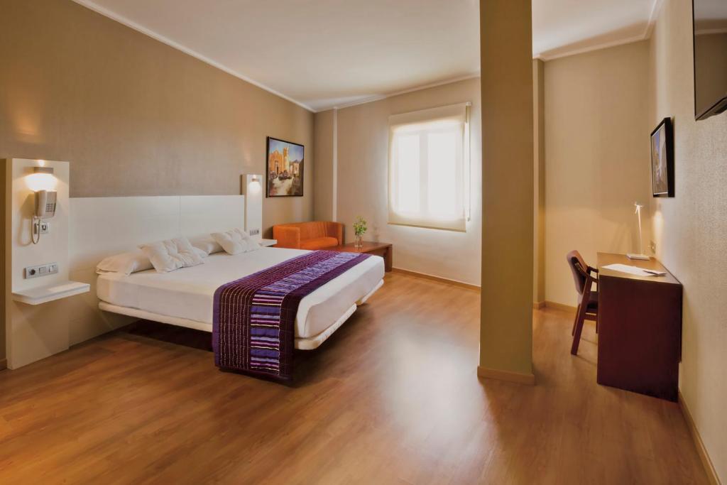 Cama o camas de una habitación en Hotel Fuente El Cura
