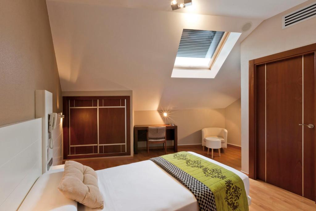 Cama o camas de una habitación en Hotel Fuente El Cura
