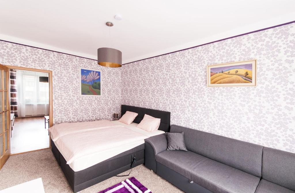 Postel nebo postele na pokoji v ubytování Apartman Zacler v Krkonosich