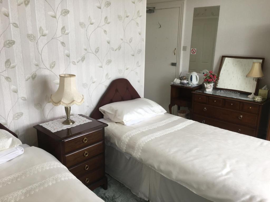 Postel nebo postele na pokoji v ubytování Bron Orme Private Hotel