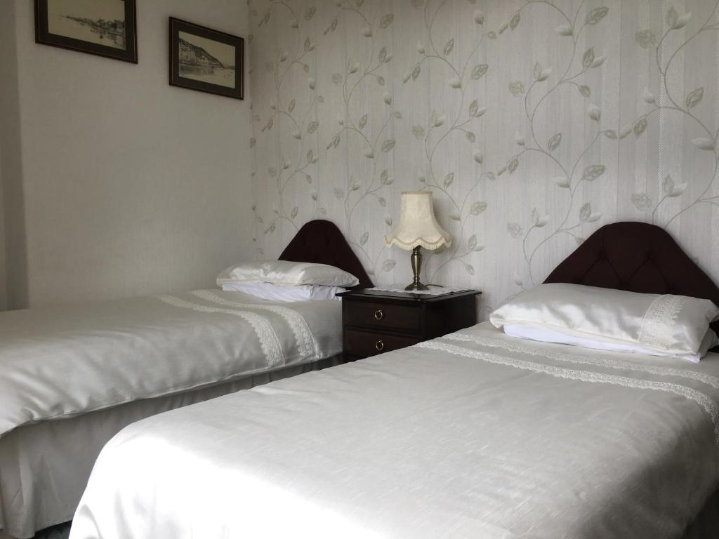 Postel nebo postele na pokoji v ubytování Bron Orme Private Hotel