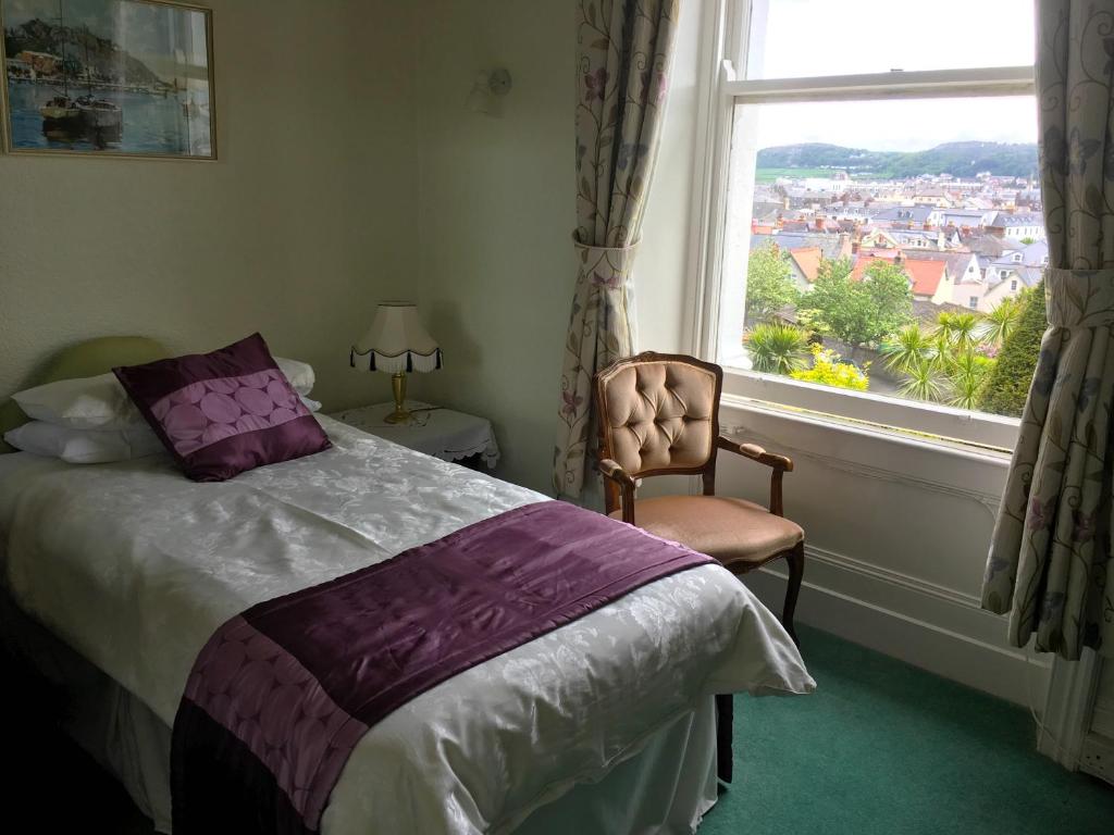 Postel nebo postele na pokoji v ubytování Bron Orme Private Hotel