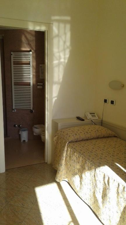 Postel nebo postele na pokoji v ubytování Hotel Feluca