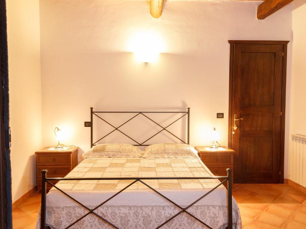 Łóżko lub łóżka w pokoju w obiekcie Agriturismo Il Rustico