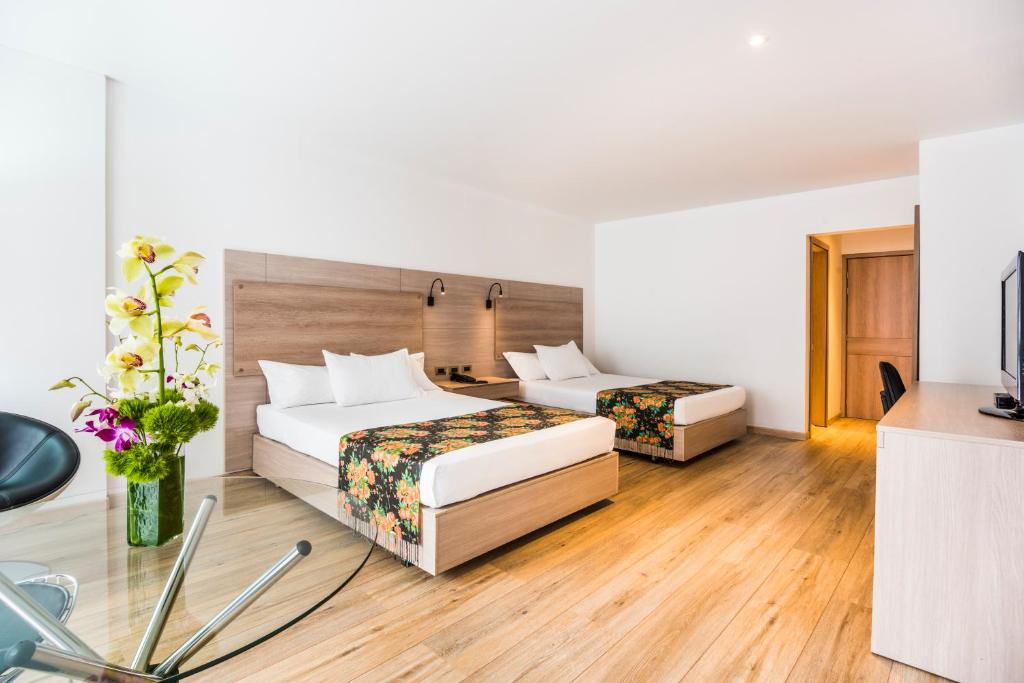 Postel nebo postele na pokoji v ubytování Hotel Rosales Plaza