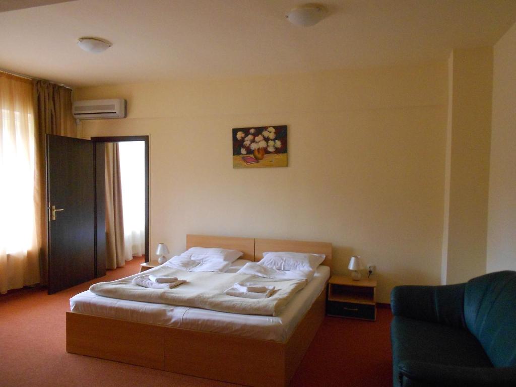 Postel nebo postele na pokoji v ubytování Hotel Diana
