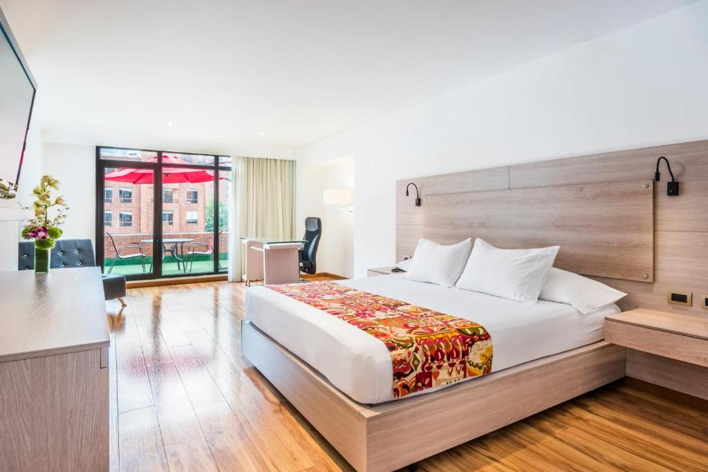 Postel nebo postele na pokoji v ubytování Hotel Rosales Plaza