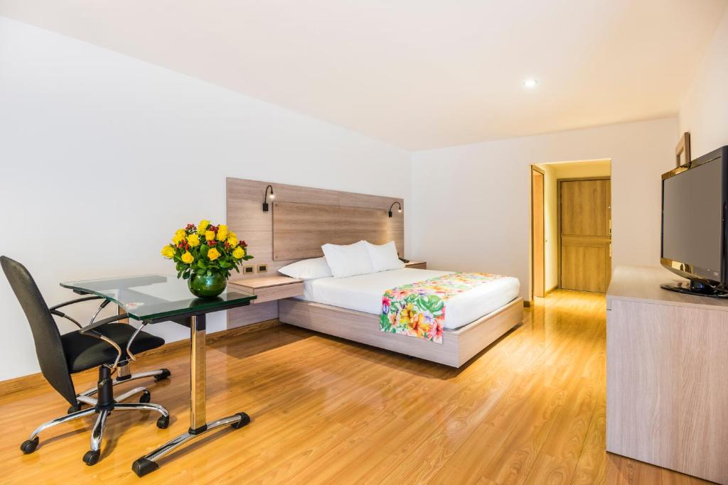 Postel nebo postele na pokoji v ubytování Hotel Rosales Plaza