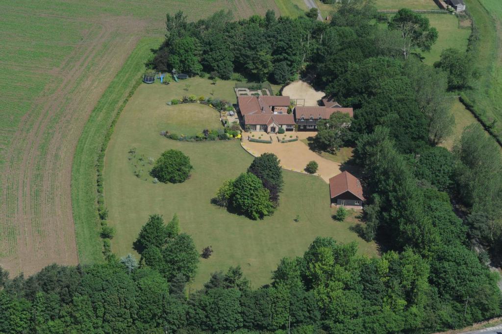 an aerial view of a large house in a field at Luxury Escape in Hunstanton