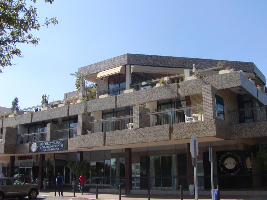 a building with people standing in front of it at Brooklyn Lodge in Pretoria