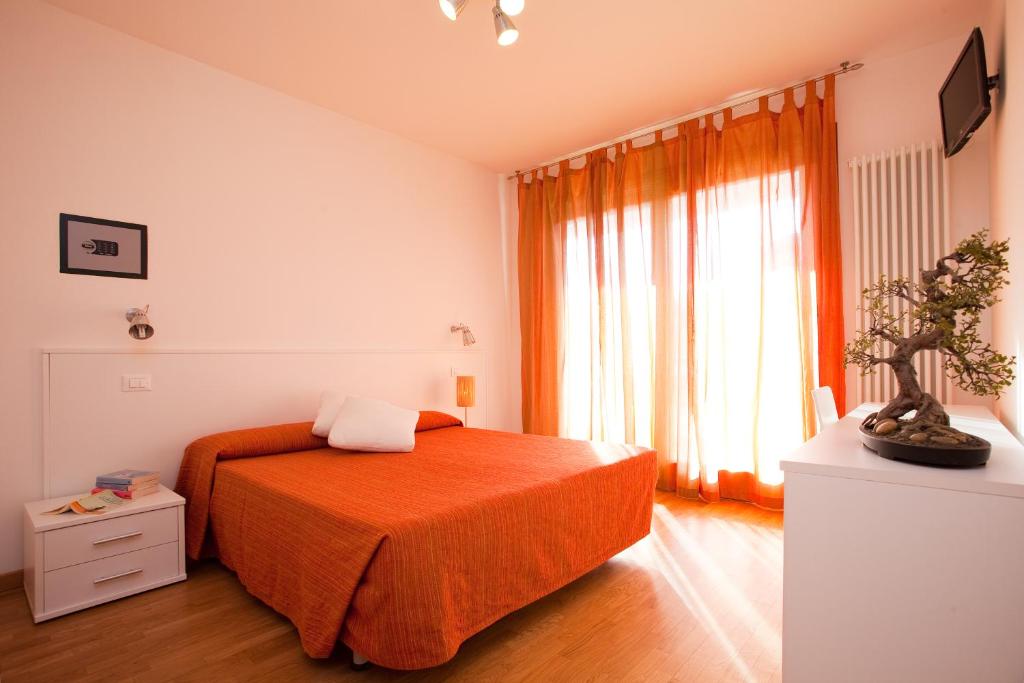 Rúm í herbergi á Residence Speranza