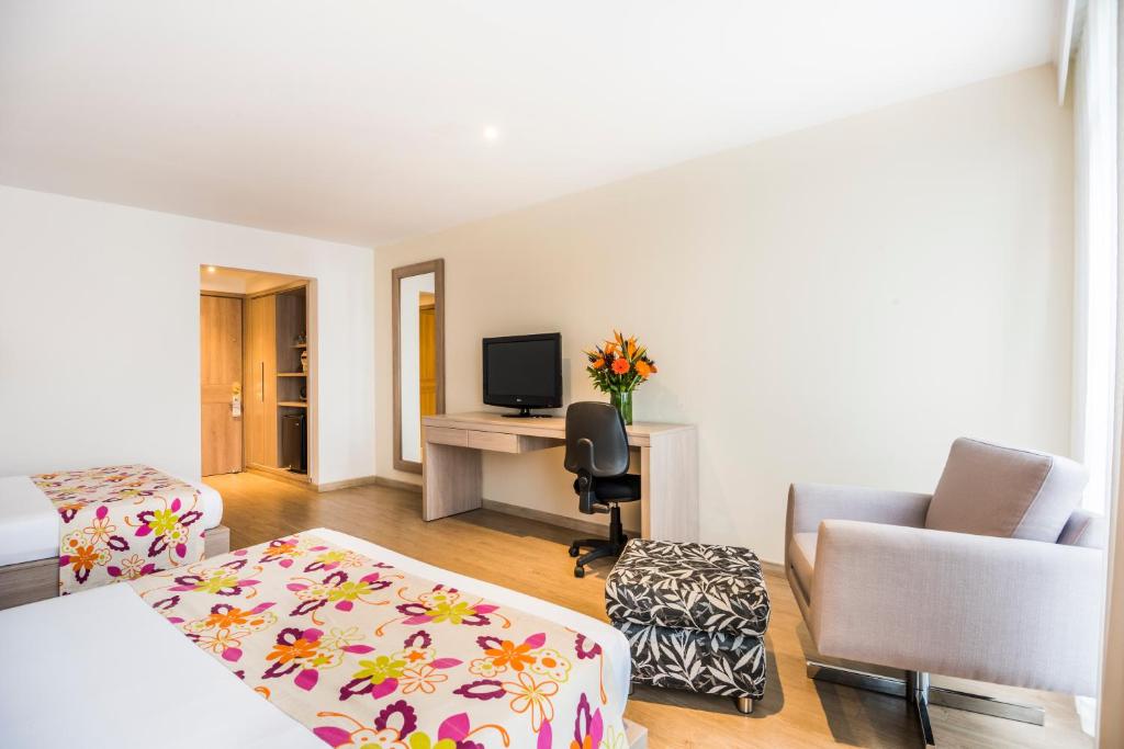Postel nebo postele na pokoji v ubytování Hotel Rosales Plaza
