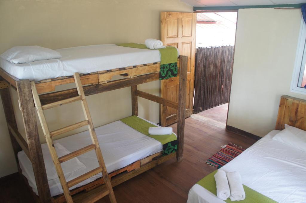 Postel nebo postele na pokoji v ubytování Cebaco Sunrise Lodge