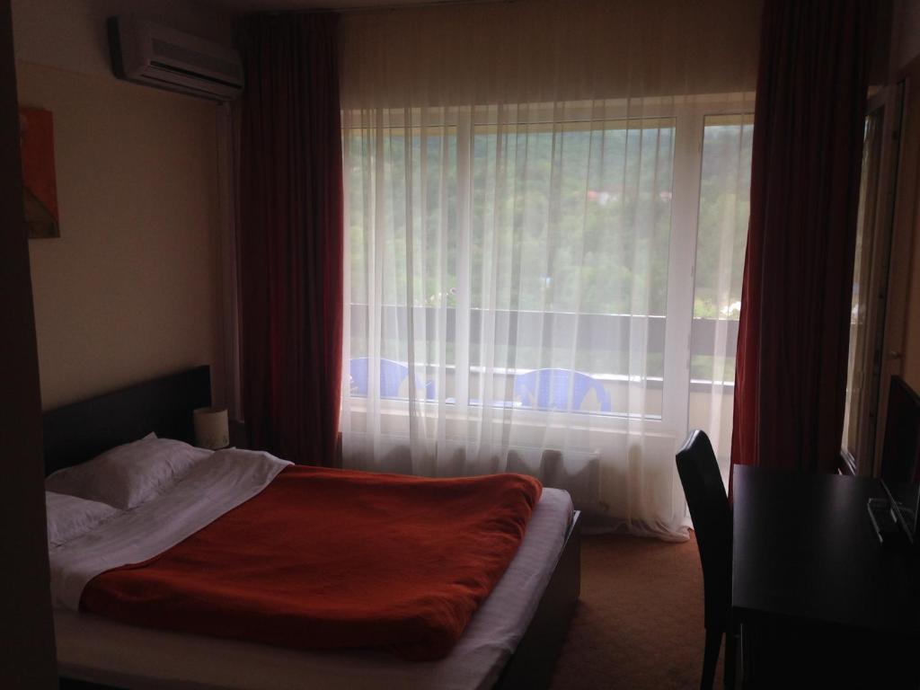 Postel nebo postele na pokoji v ubytování Hotel Diana
