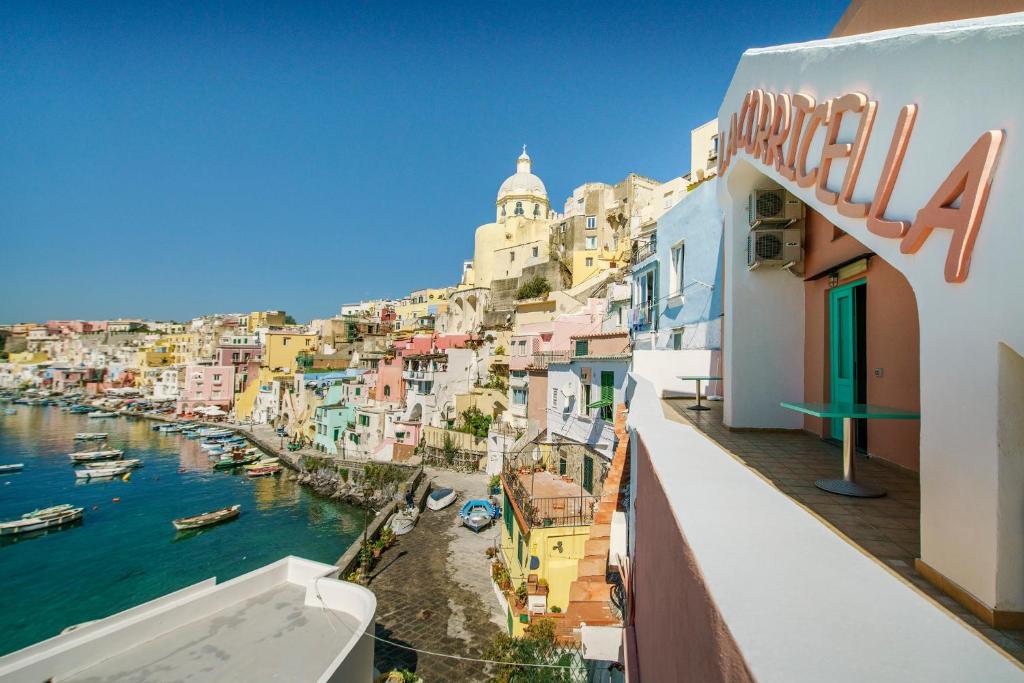 a view of a harbor with boats in the water at Hotel La Corricella in Procida