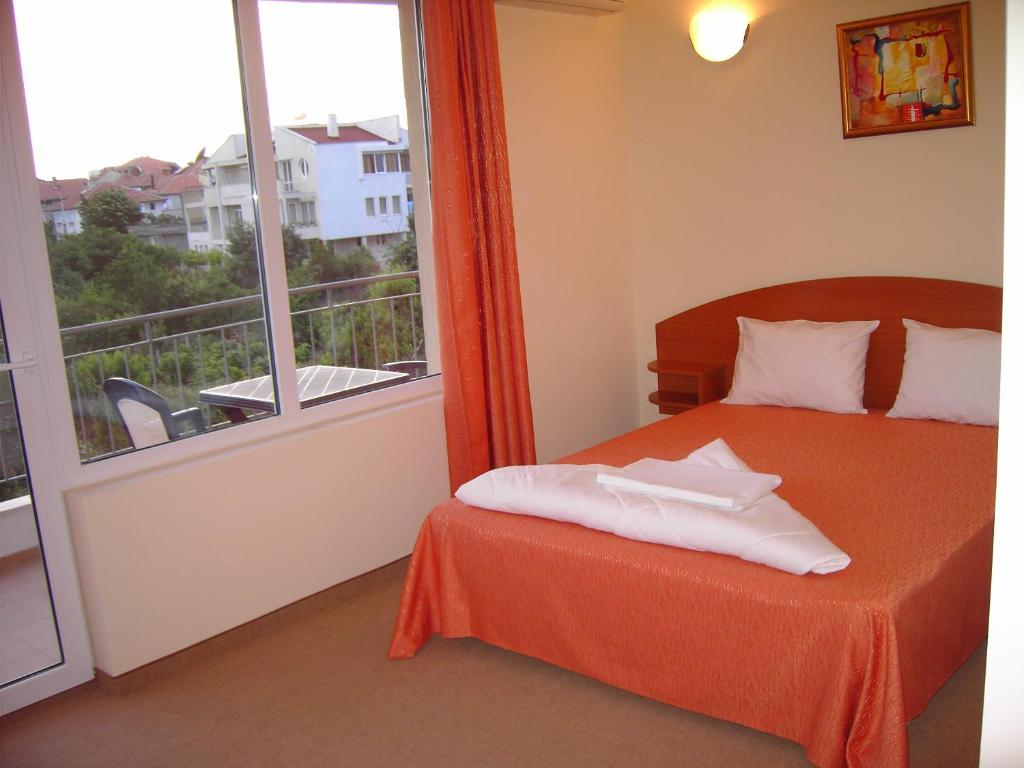 Postel nebo postele na pokoji v ubytování Family Hotel Deja Vu