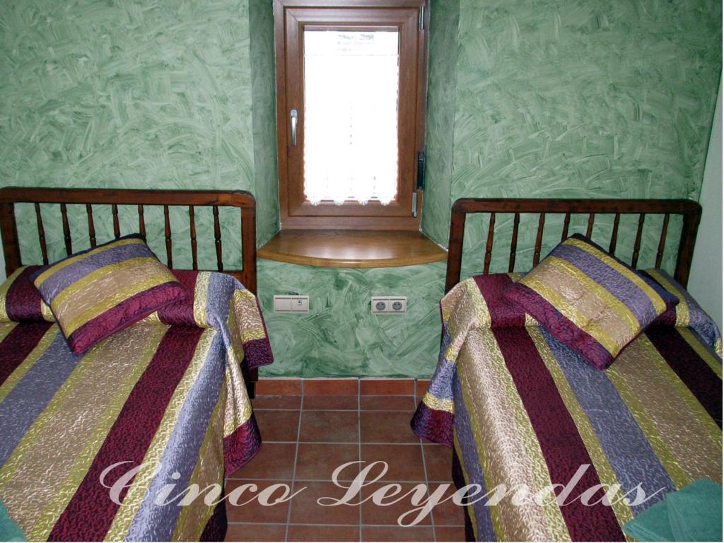 Postel nebo postele na pokoji v ubytování Cinco Leyendas