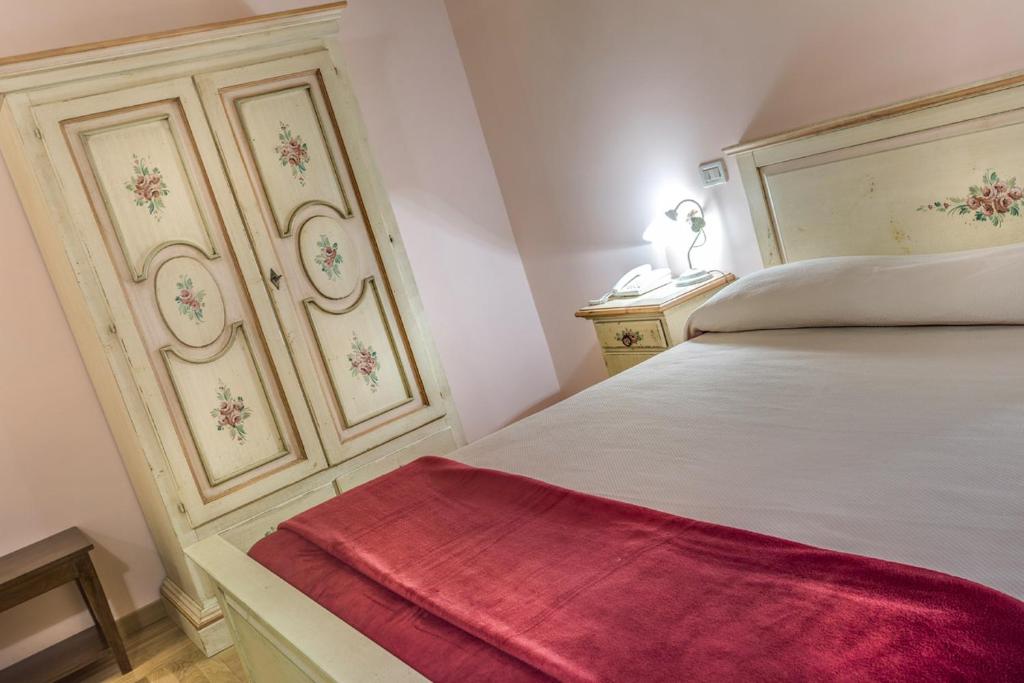 Postel nebo postele na pokoji v ubytování La Castellaia Resort