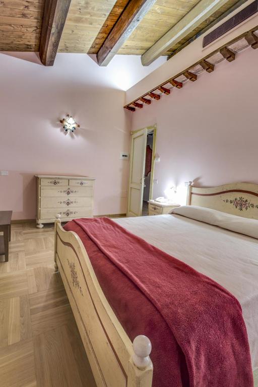 Postel nebo postele na pokoji v ubytování La Castellaia Resort