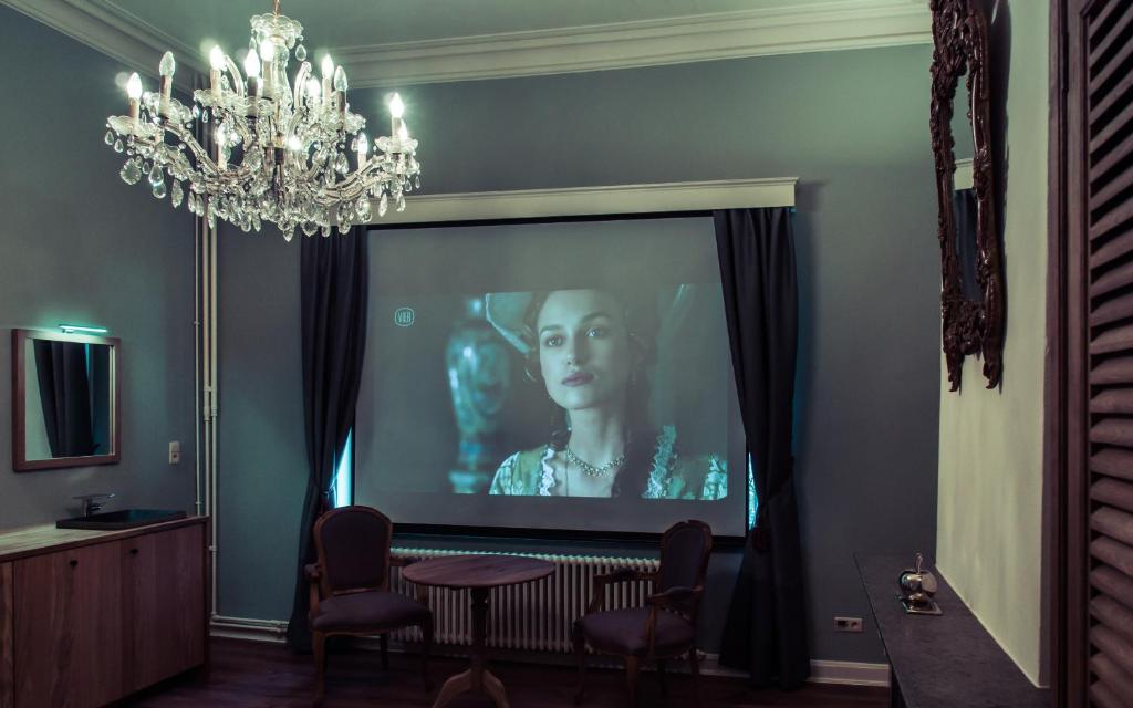 TV a/nebo společenská místnost v ubytování Maison Willem Tell