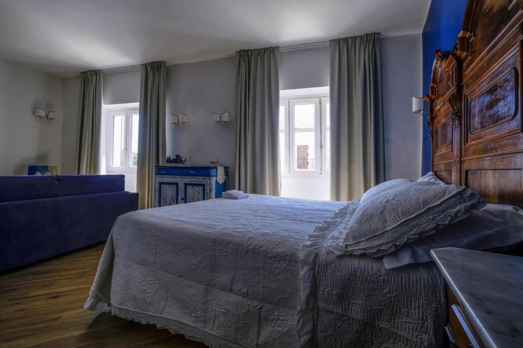 Postel nebo postele na pokoji v ubytování L'Orizzonte Relais Sirolo