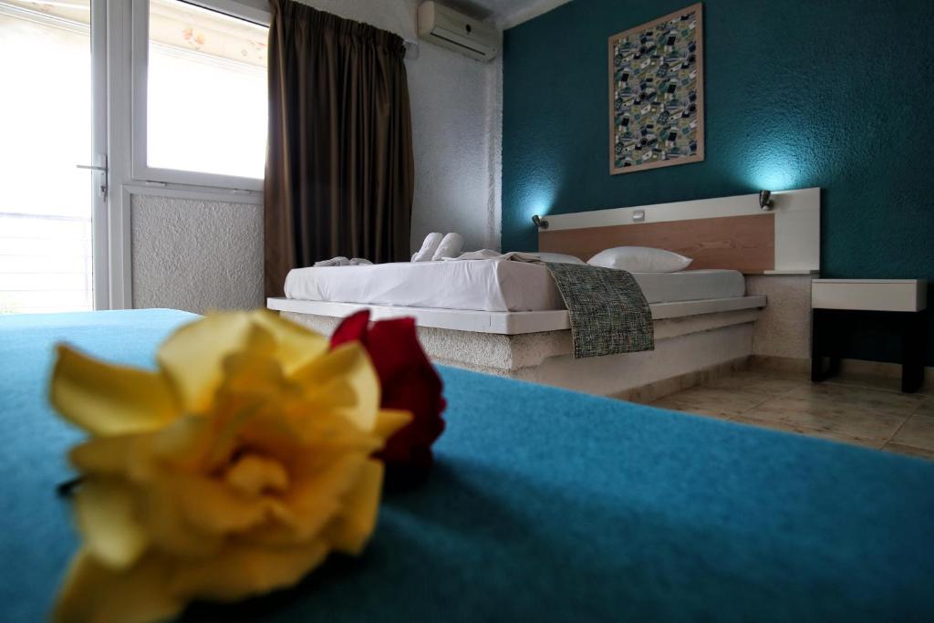 A bed or beds in a room at Ermioni Apartments