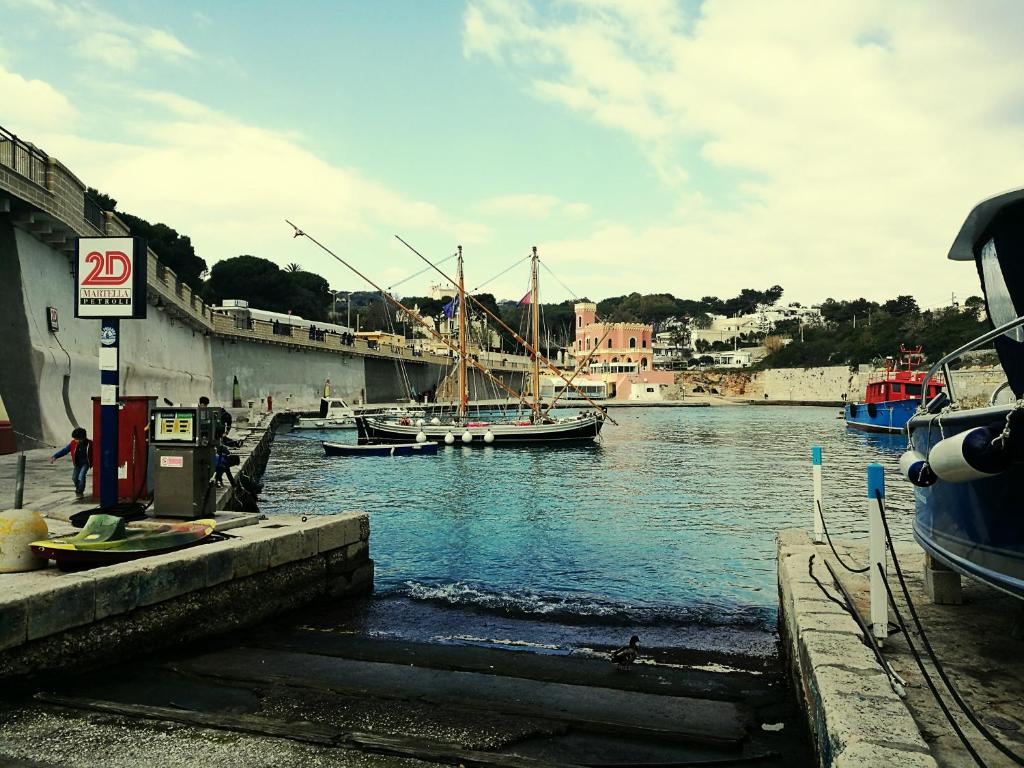 a group of boats docked in a body of water at Sant'Andrea in Tricase