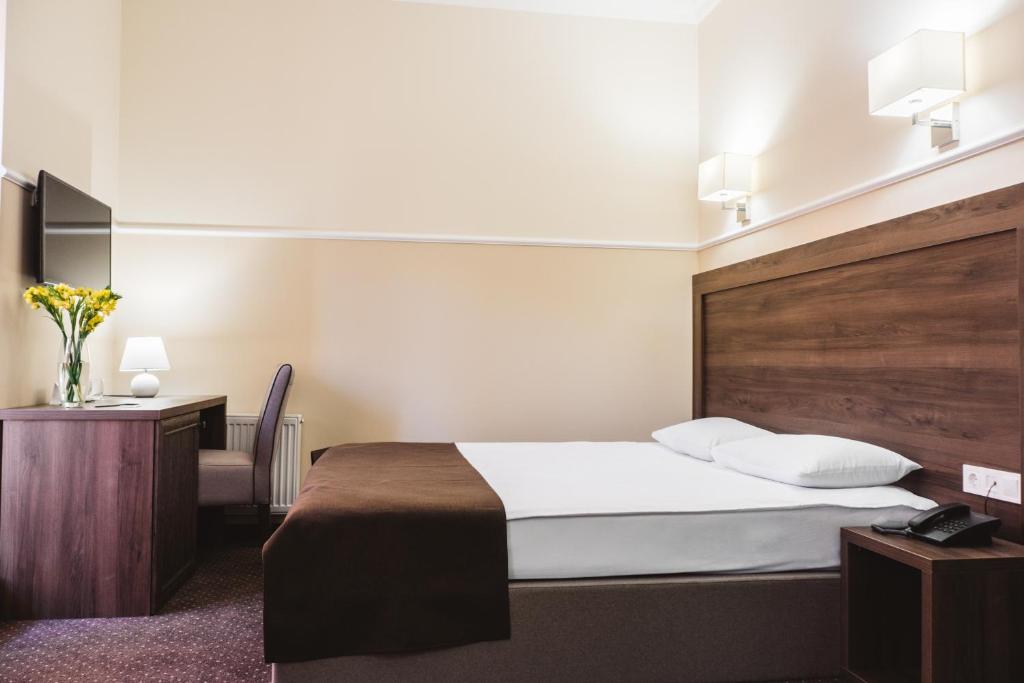 Postel nebo postele na pokoji v ubytování Potemkinn Hotel