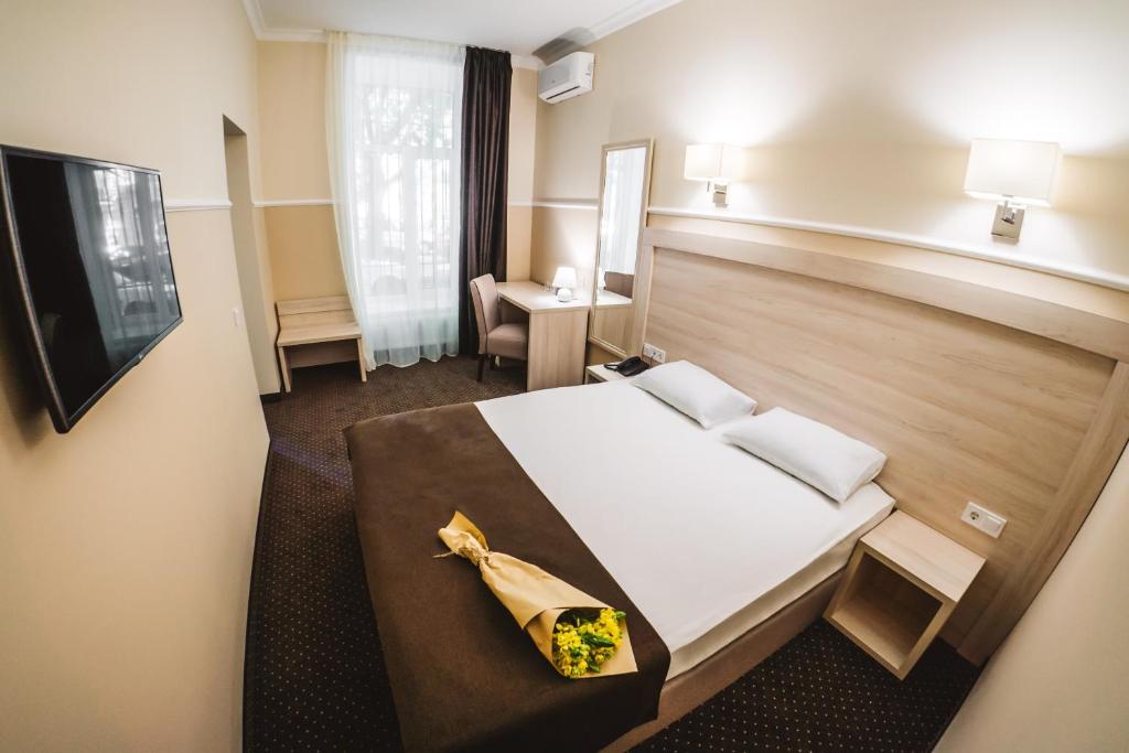 Postel nebo postele na pokoji v ubytování Potemkinn Hotel