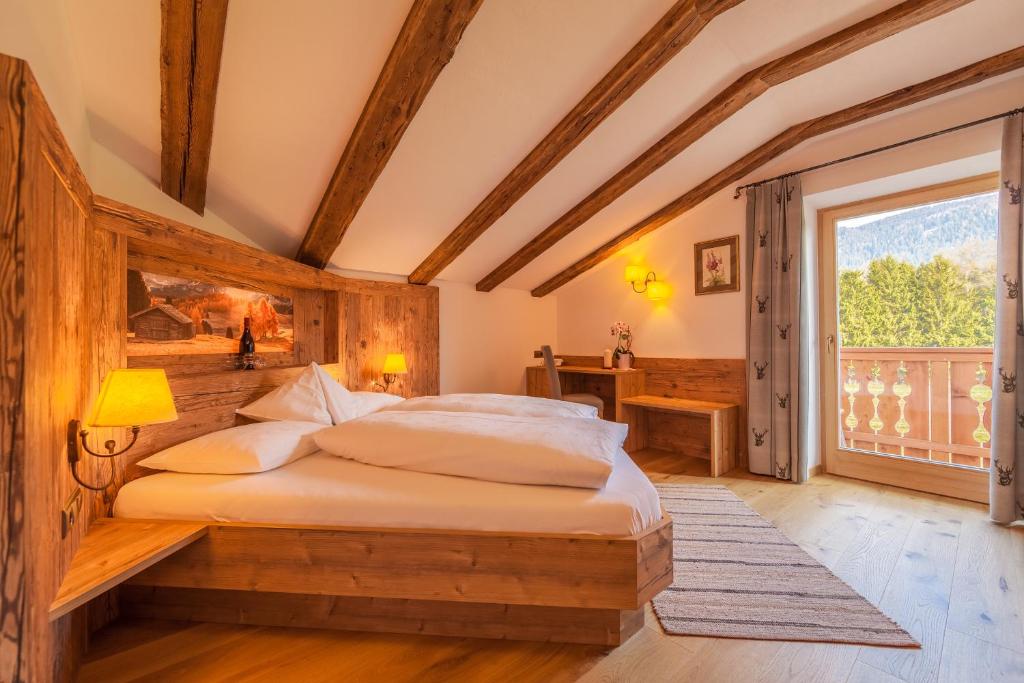 Postel nebo postele na pokoji v ubytování Hotel Hubertushof