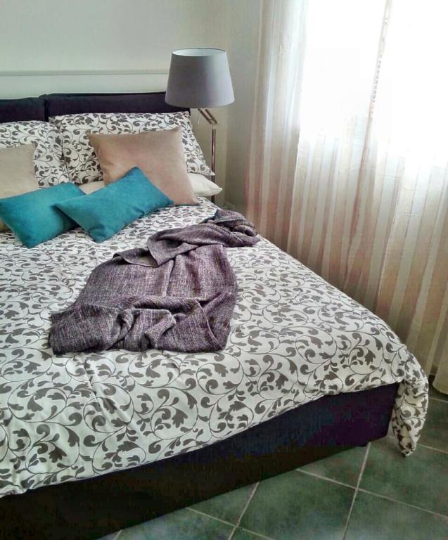 Posteľ alebo postele v izbe v ubytovaní Capo House