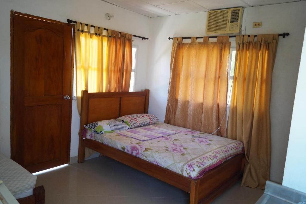 Postel nebo postele na pokoji v ubytování Condominio Punta Bolivar
