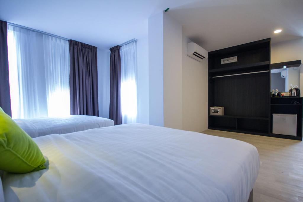 Postel nebo postele na pokoji v ubytování Manhattan Hotel Ipoh