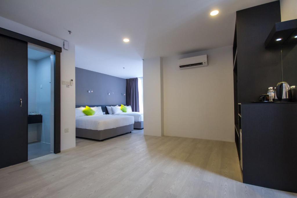 Postel nebo postele na pokoji v ubytování Manhattan Hotel Ipoh