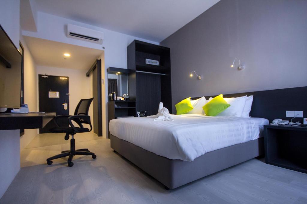 Postel nebo postele na pokoji v ubytování Manhattan Hotel Ipoh