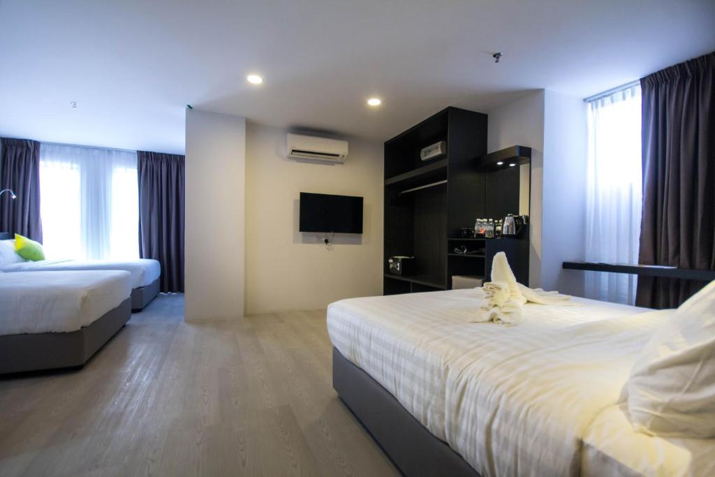 Postel nebo postele na pokoji v ubytování Manhattan Hotel Ipoh